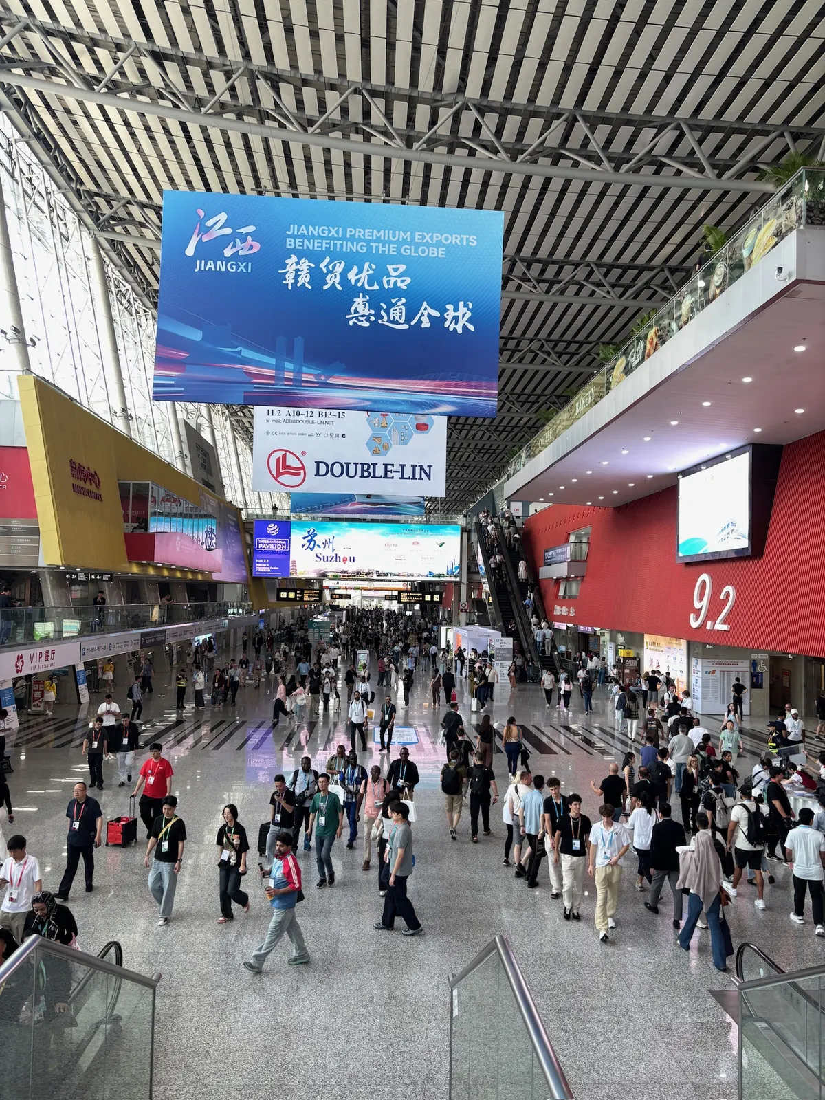 Visitors walking through a busy concourse at the Canton Fair