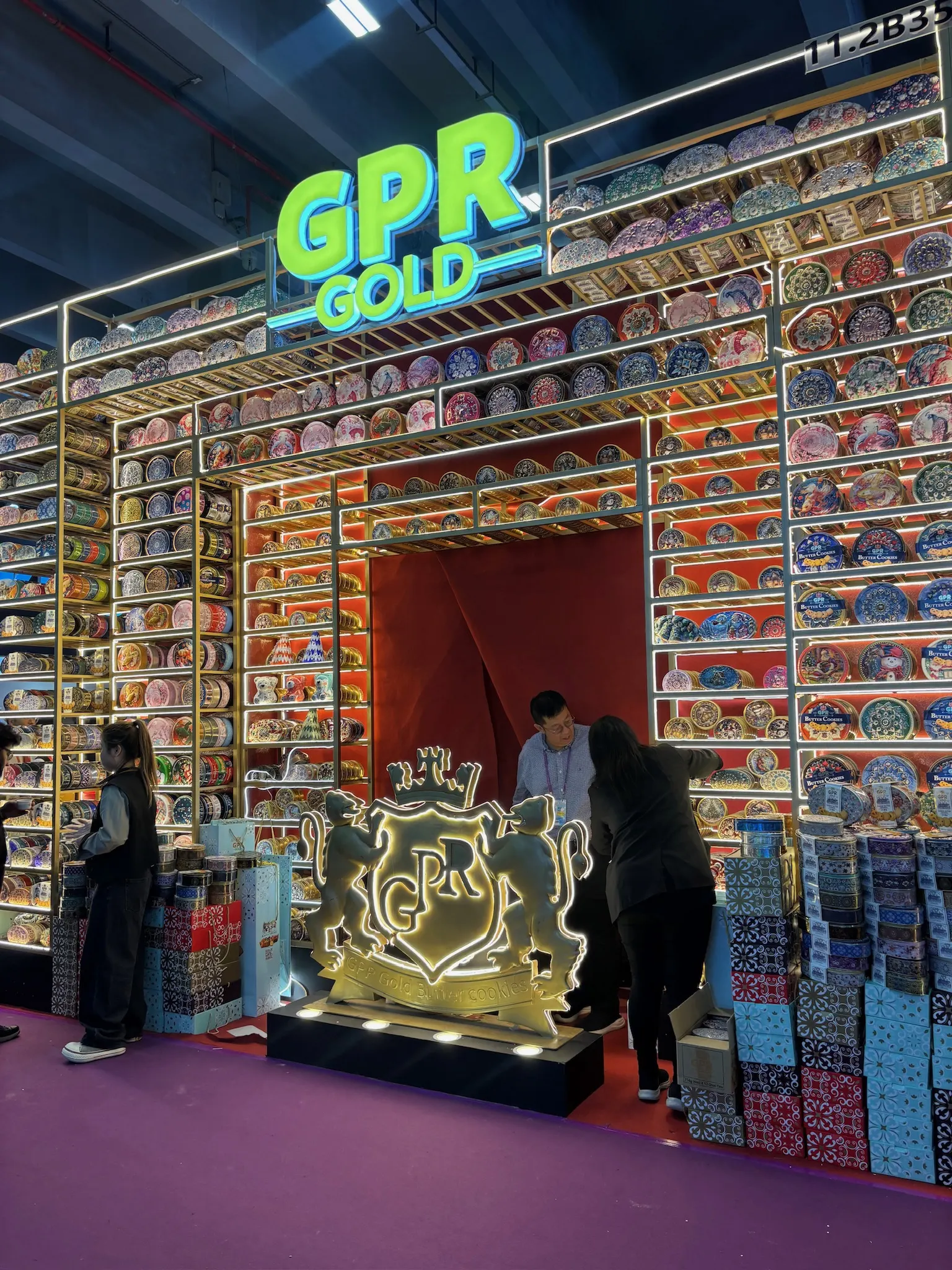 Trade fair booth in Guangzhou stacked with decorative printed tins and gift box packaging